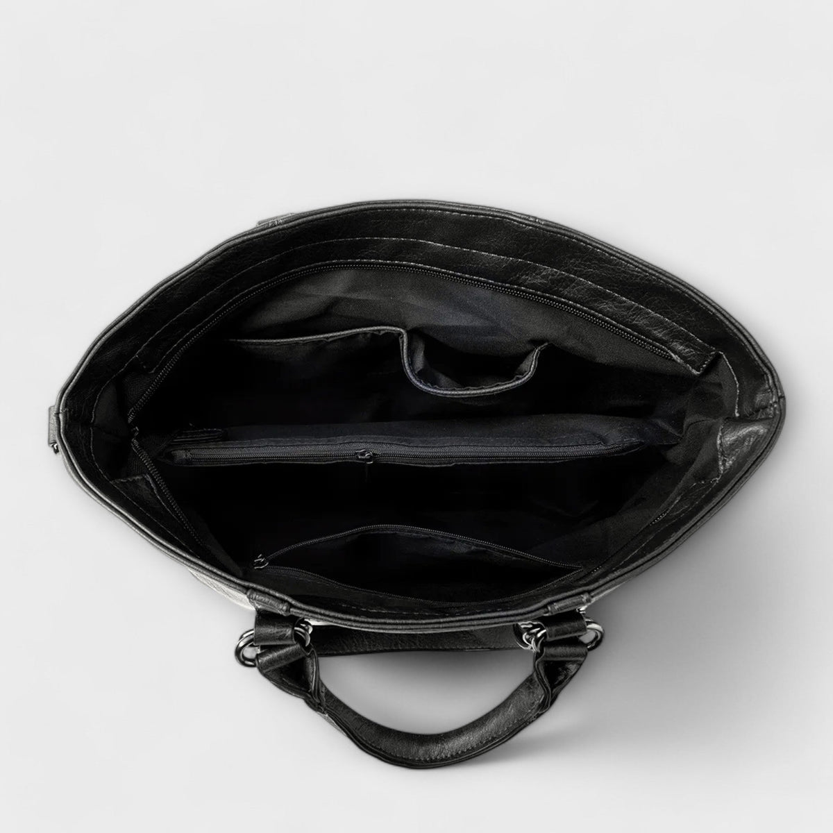 Olívia large tote bag in black, interior view showing zip and slip pockets