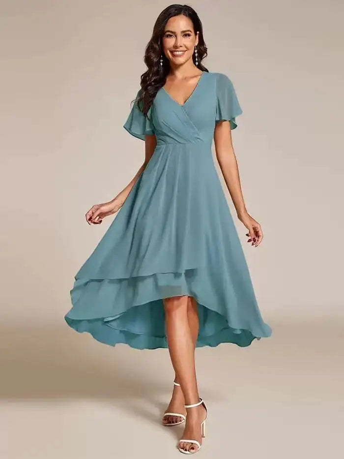 Ismey elegant flowing dress in teal blue, full-length front view
