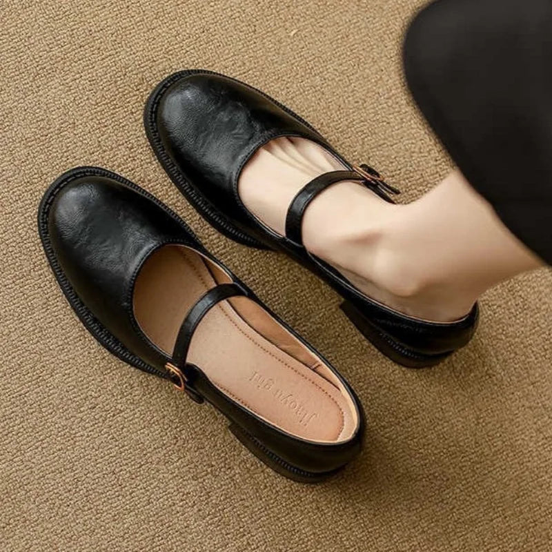 Dorvanna Mary Janes in black, worn top view with buckled strap