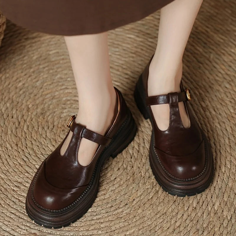 Luna classic T-bar shoes in brown, worn with a midi skirt