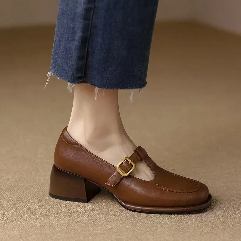 Selvana T-strap shoes in brown, worn with cropped blue jeans