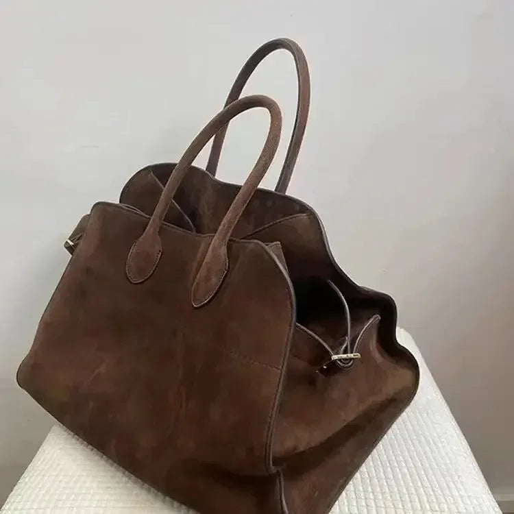Sarah vintage minimalist handbag in brown, angled view showing double handles