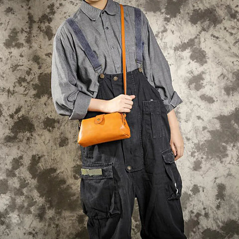 Cressida mini crossbody bag in cognac worn crossbody by a model
