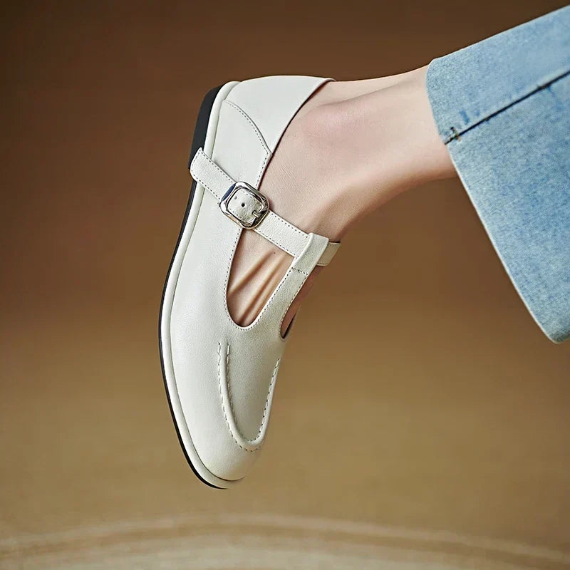 Laura beige T-strap pump close-up showing buckle and stitching