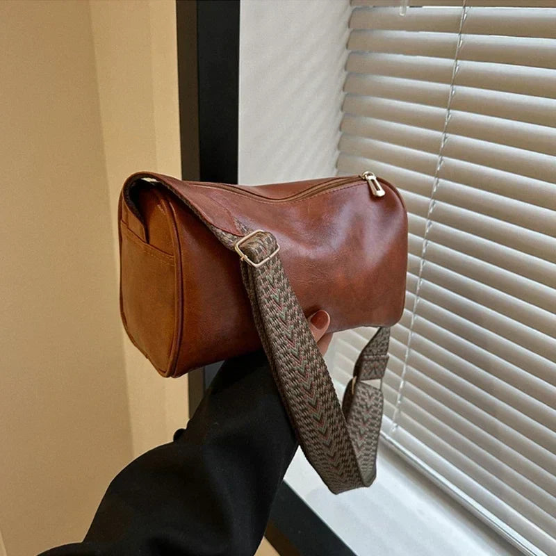 Florence crossbody bag in brown, side view with patterned strap