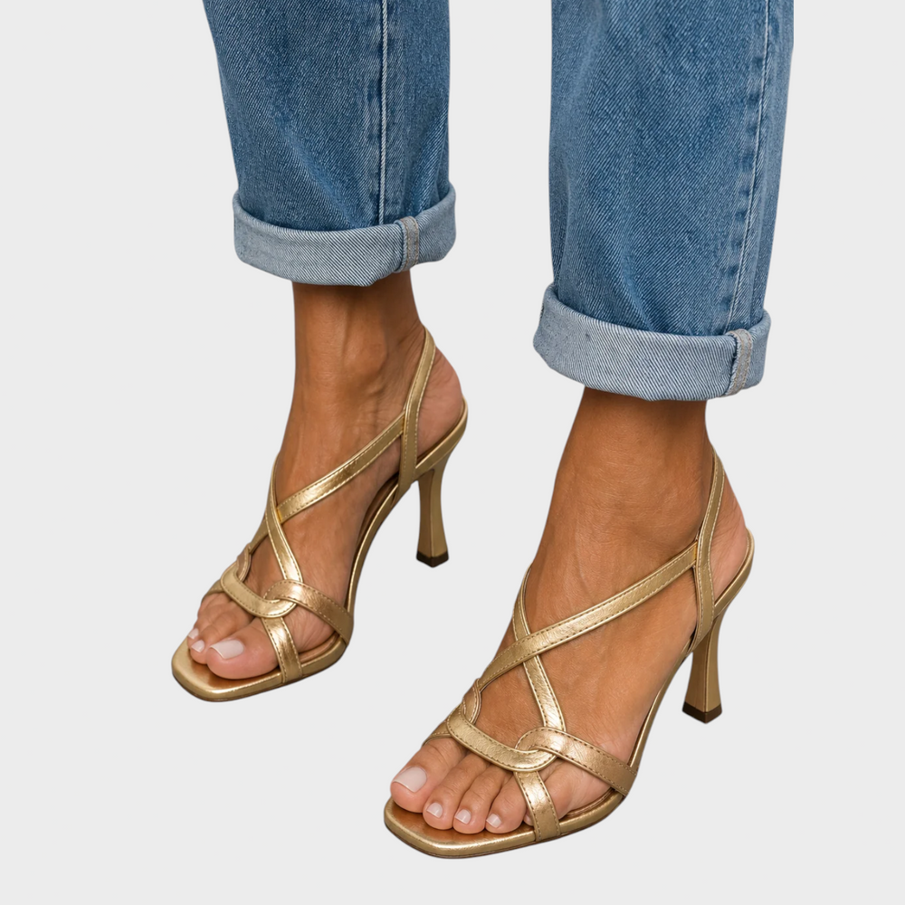 Margot gold strappy heeled sandals, front view worn with rolled-up jeans