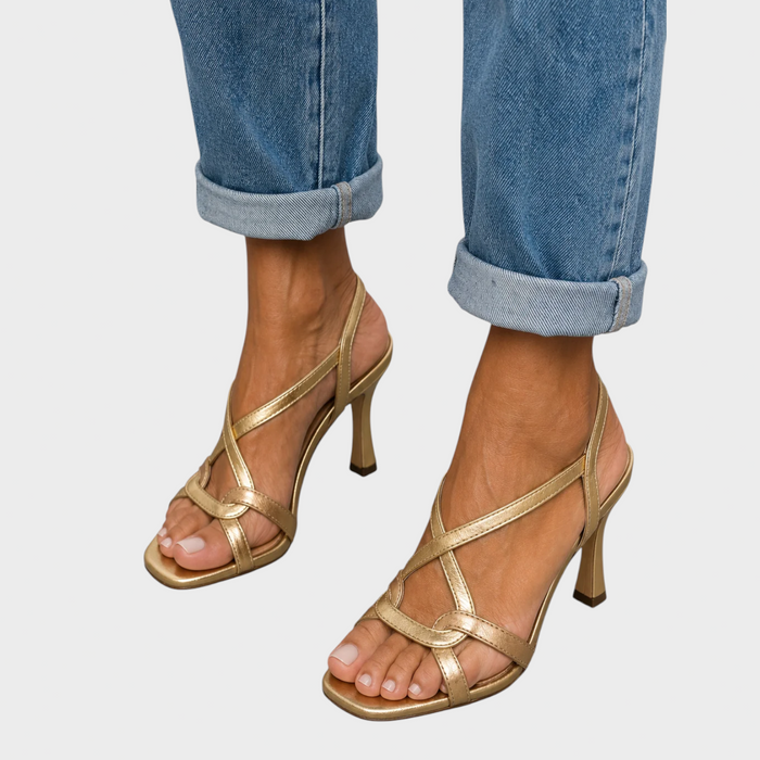 Margot gold strappy heeled sandals, front view worn with rolled-up jeans