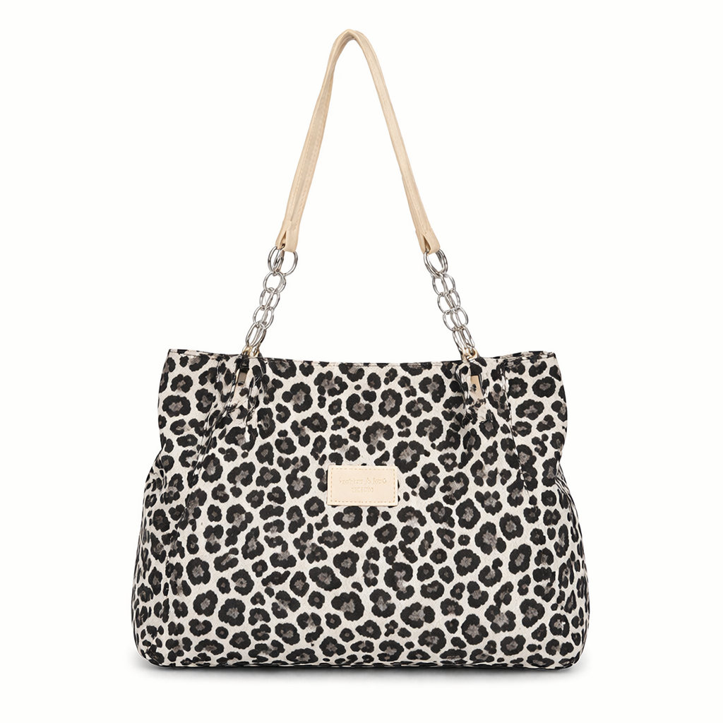 Snow leopard tote bag with silver chain straps, front view