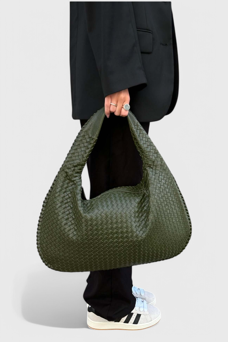 Tilly knitted shoulder bag in green, carried by model