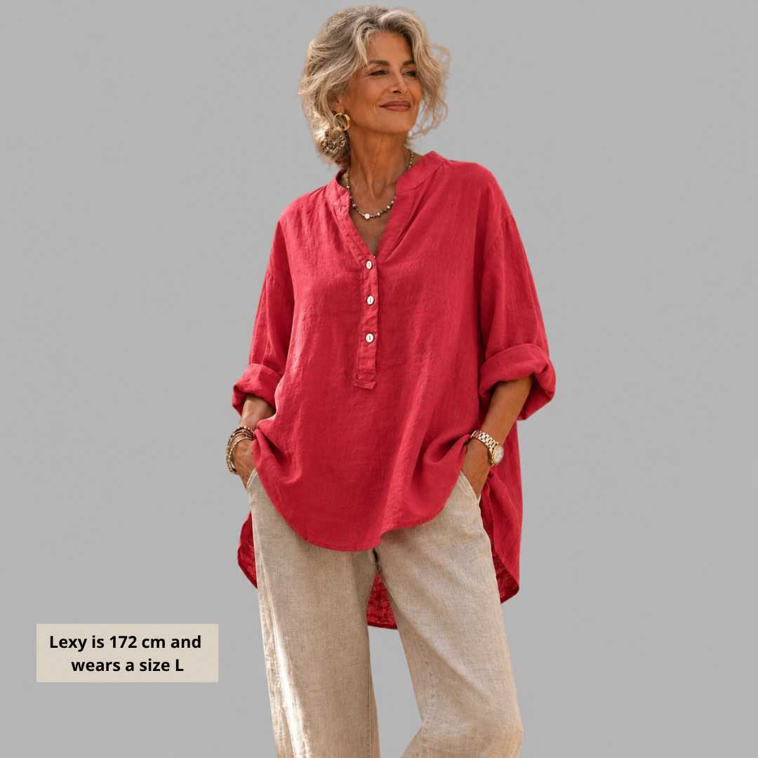 Veronique V-neck blouse in watermelon pink, worn with linen trousers, front view