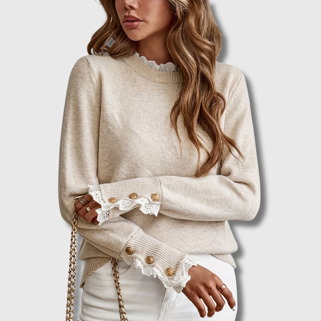 Close-up of Tala sweater lace cuff with gold-tone buttons