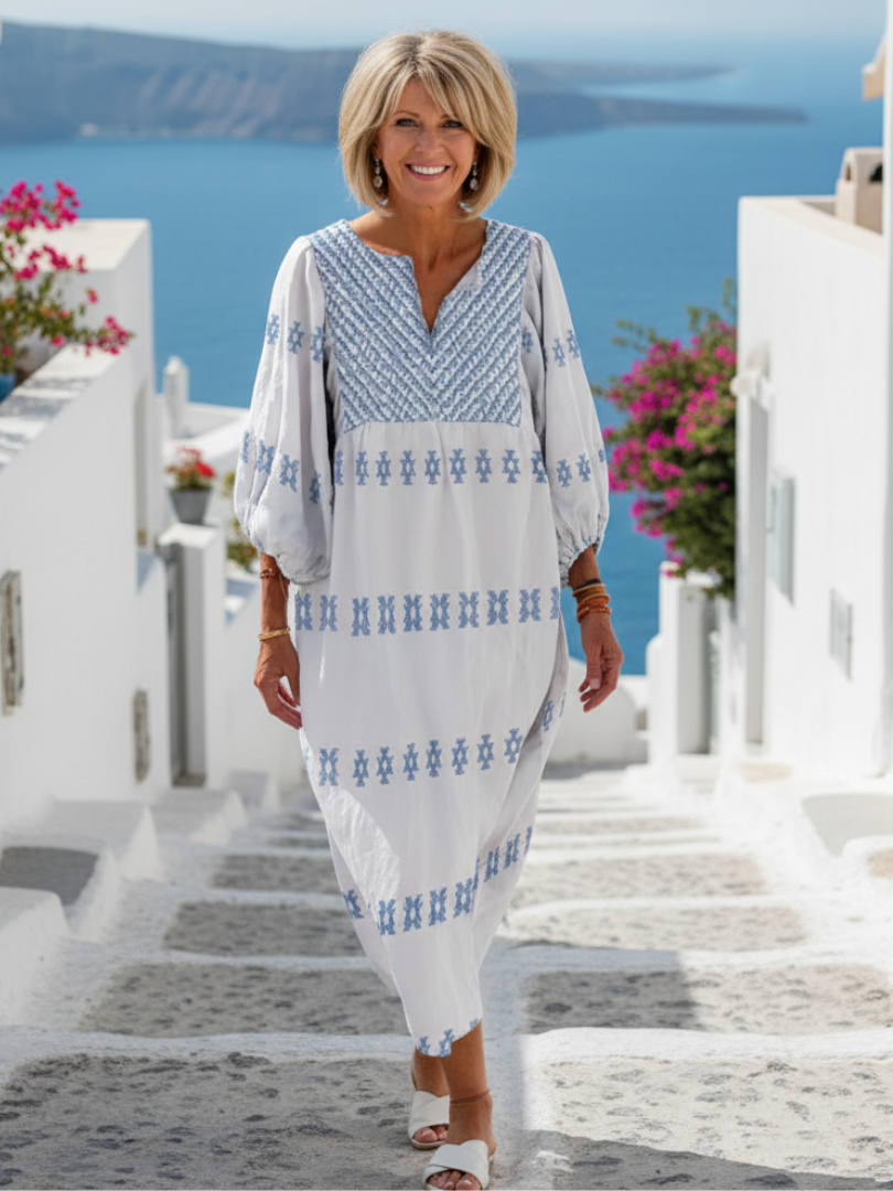 Evadne embroidered maxi dress in white with blue detailing, full-length front view
