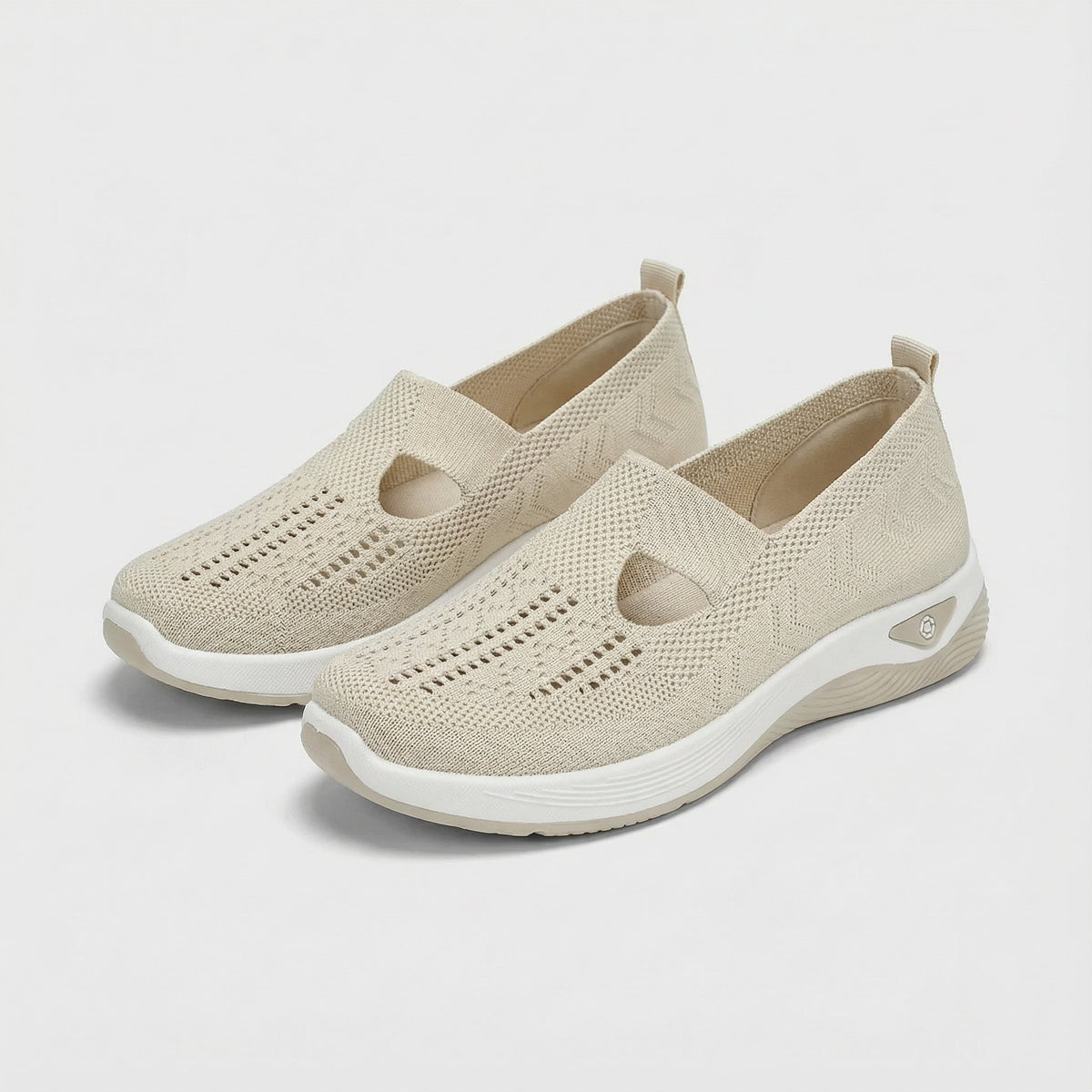 Carry knitted slip-on shoes in beige, angled pair view