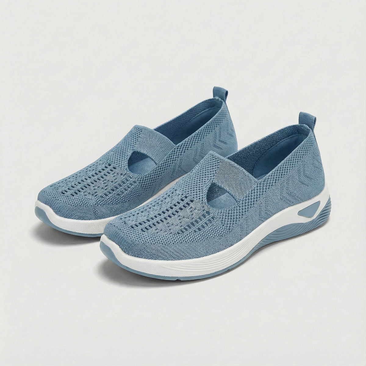 Carry knitted slip-on shoes in light blue, angled pair view