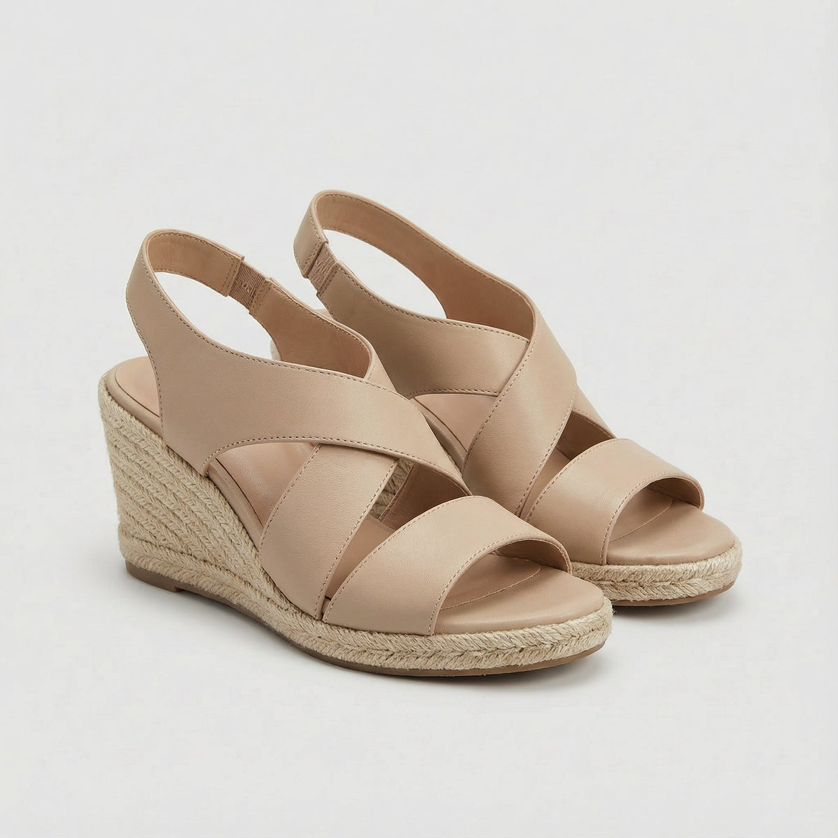 Marilysa crossover wedge sandals in beige, three-quarter pair view