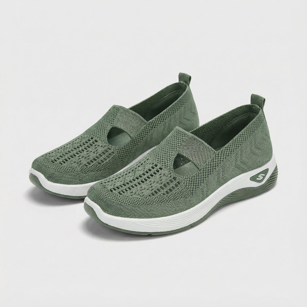 Carry knitted slip-on shoes in green, angled pair view