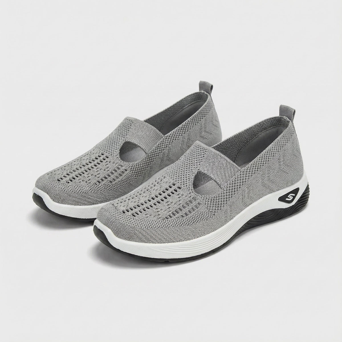 Carry knitted slip-on shoes in grey, angled pair view