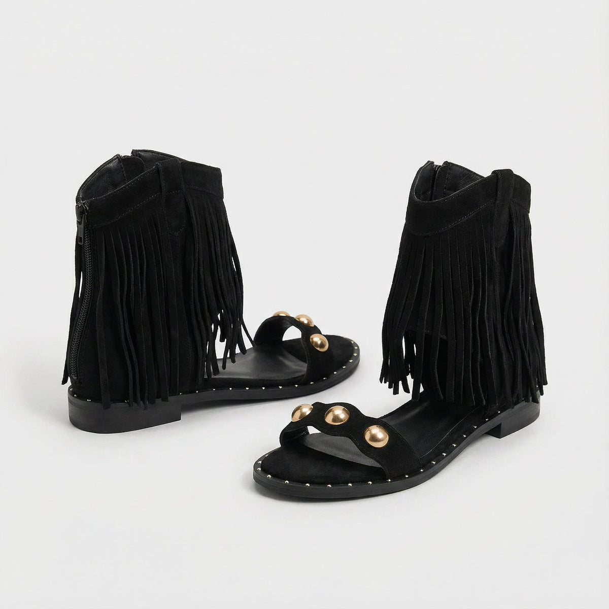 Giselina fringed sandals in black, pair shown from the side