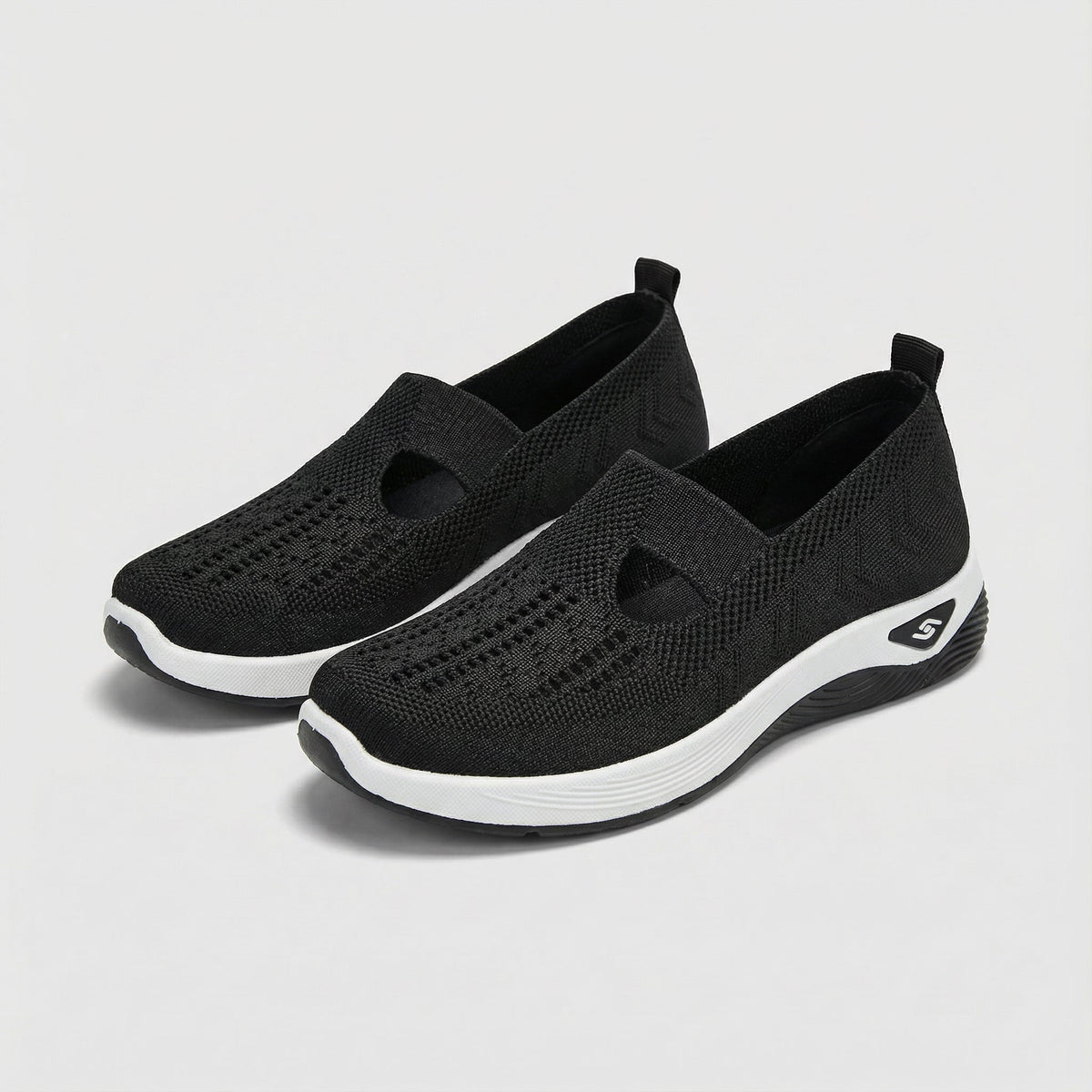 Carry knitted slip-on shoes in black, angled pair view