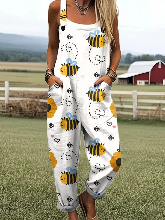 Honeybee print dungarees in white, full-length front view worn with sandals