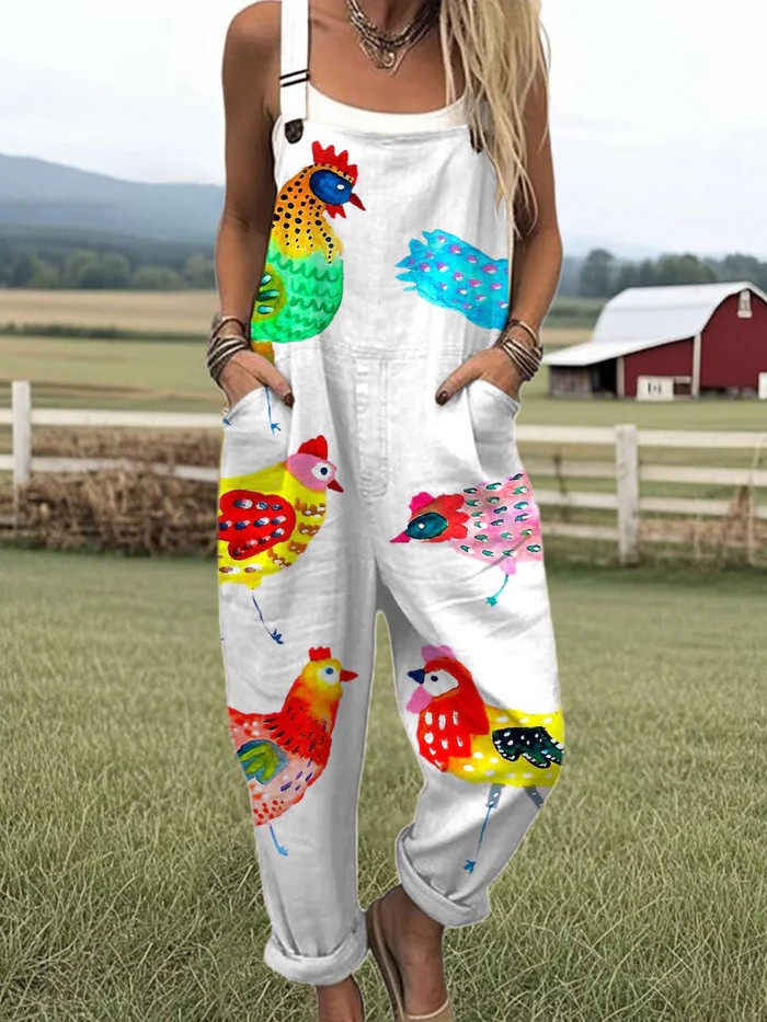 Barnyard Bloom dungarees in white with colourful chicken print, full-length front view