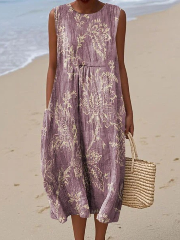 Mia floral midi dress in purple, full-length front view on the beach