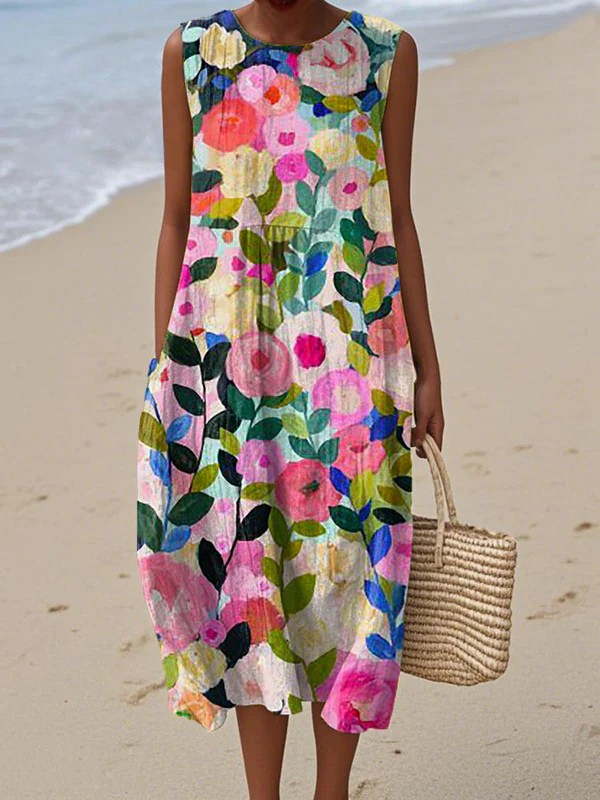 Ava floral midi dress in multicolour print, full-length front view on the beach