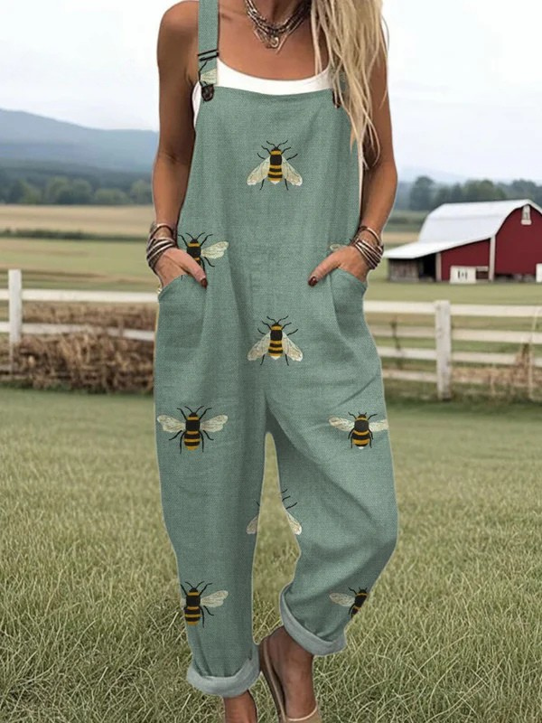 Garden Whimsy bee-print dungarees in sage green, full-length front view