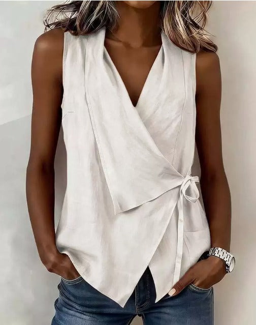 Loretta sleeveless wrap blouse in white, front view with bow tie detail