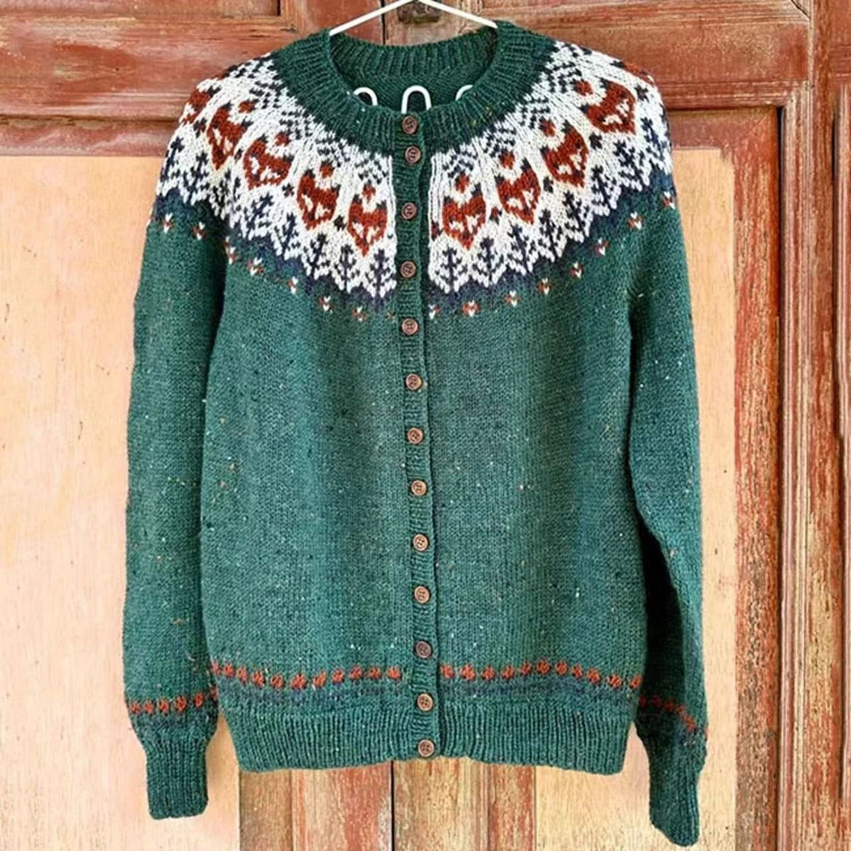 Isla vintage Icelandic cardigan in green, front view showing buttons and patterned yoke