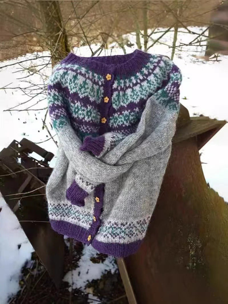 Naomi grey and purple Icelandic cardigan shown folded outdoors