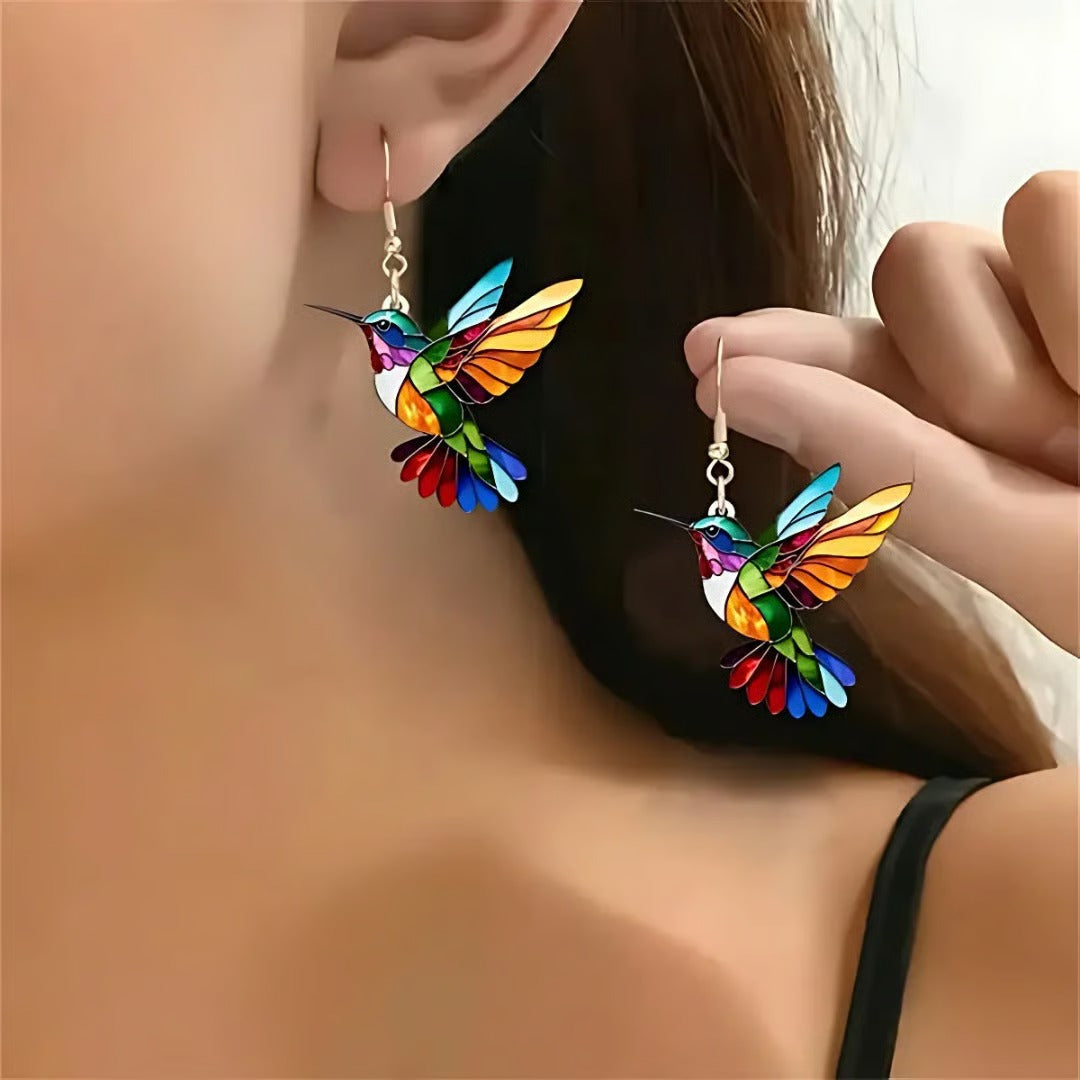 Lucky Hummingbird drop earrings in multicolour, worn close-up view