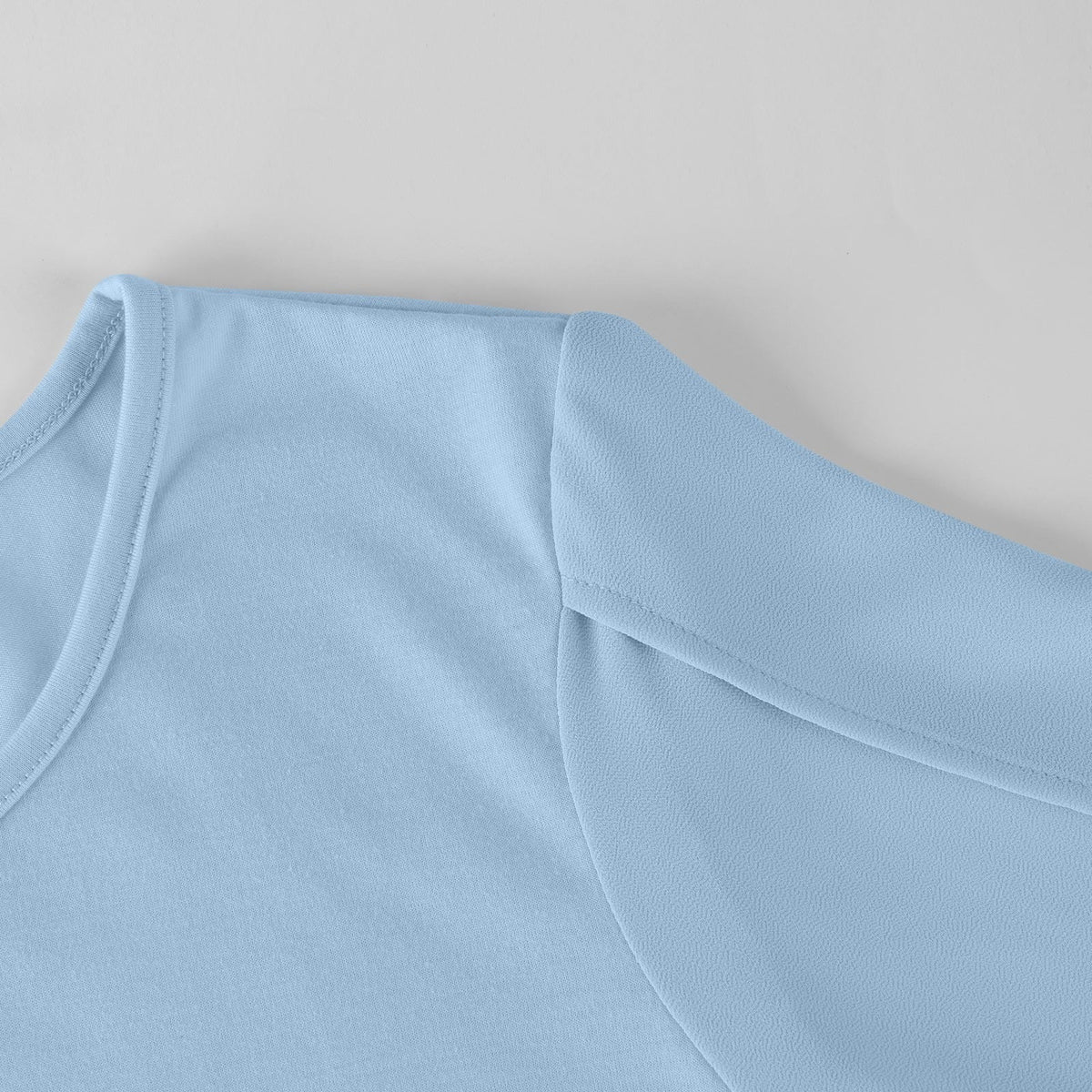 Elise dress in light blue, close-up of crew neckline and split sleeve