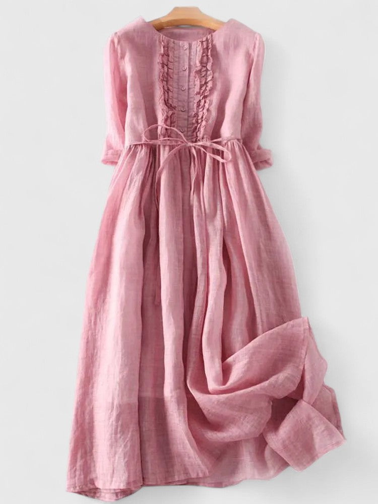 Kathryn ruffle-bib tie-waist dress in pink on a hanger