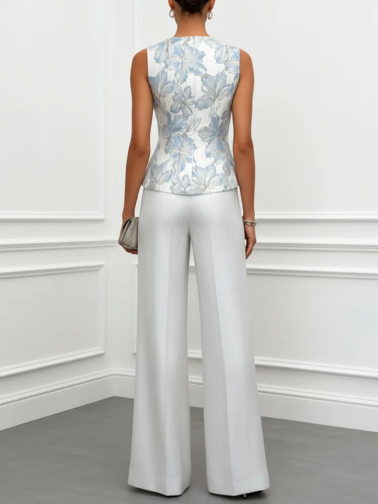 Sophia satin two-piece set in white, back view showing peplum top and wide-leg trousers