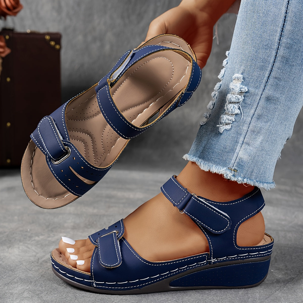 Comfort sandals in navy blue, worn side view with open toe