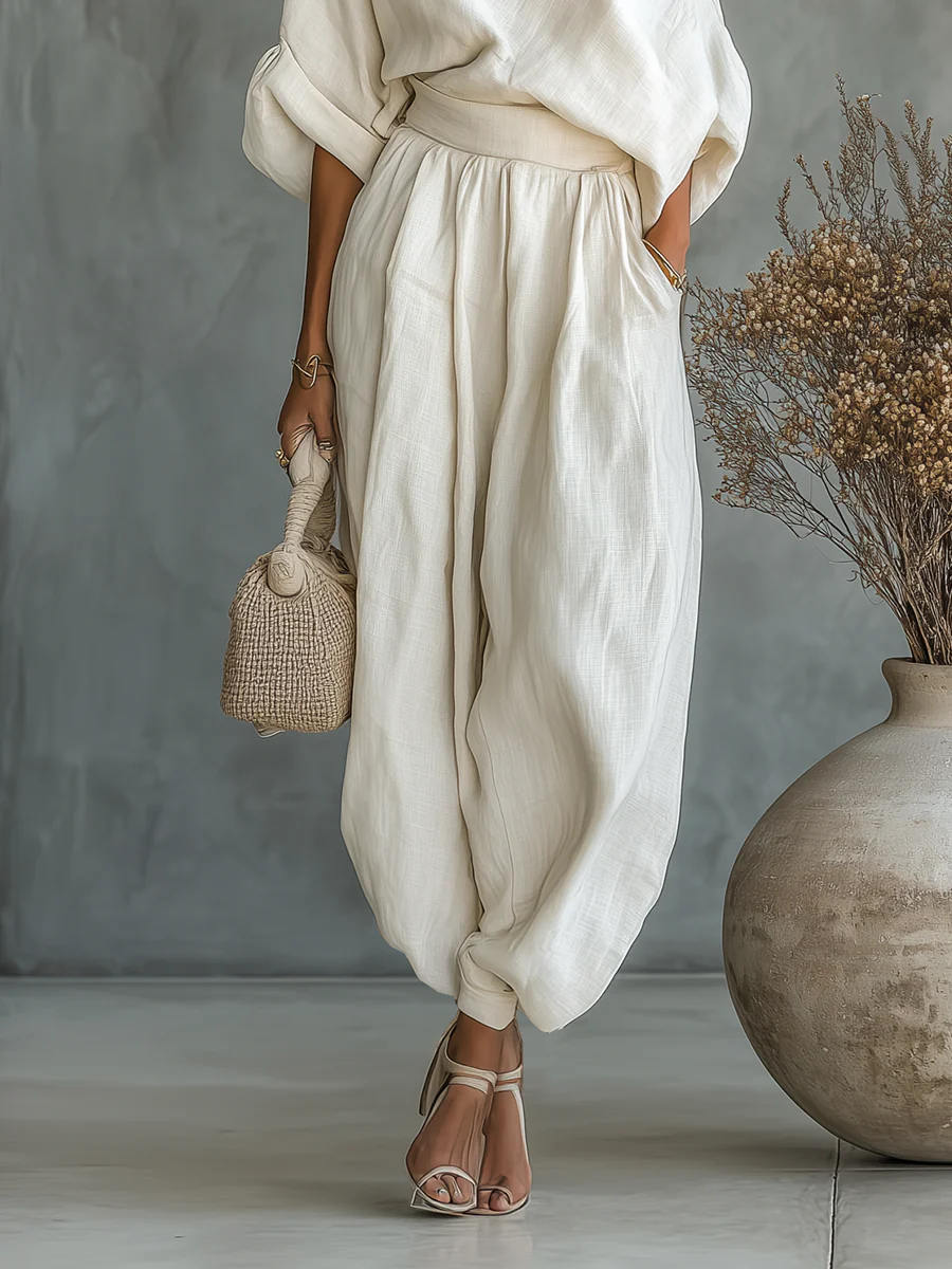 Sophie tapered linen trousers in off white, waist and hem detail