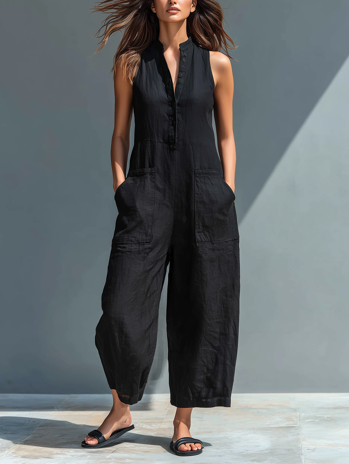 Phoebe wide-leg buttoned jumpsuit in black, full-length front view