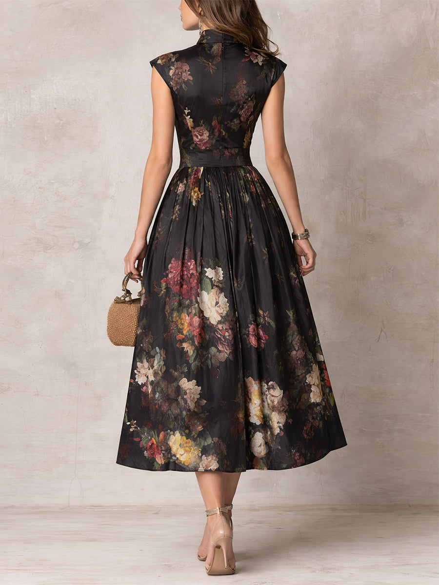 Brianne elegant midi dress in black floral, back view showing pleated skirt