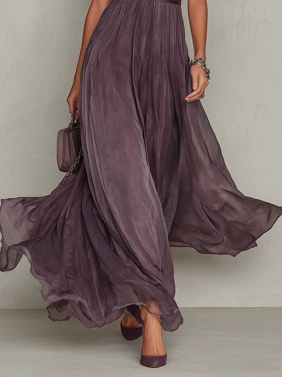 Ruby maxi dress in purple, close view of flowing pleated skirt