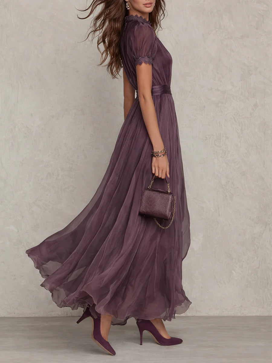 Ruby flowing maxi dress in purple, side view with sweeping skirt