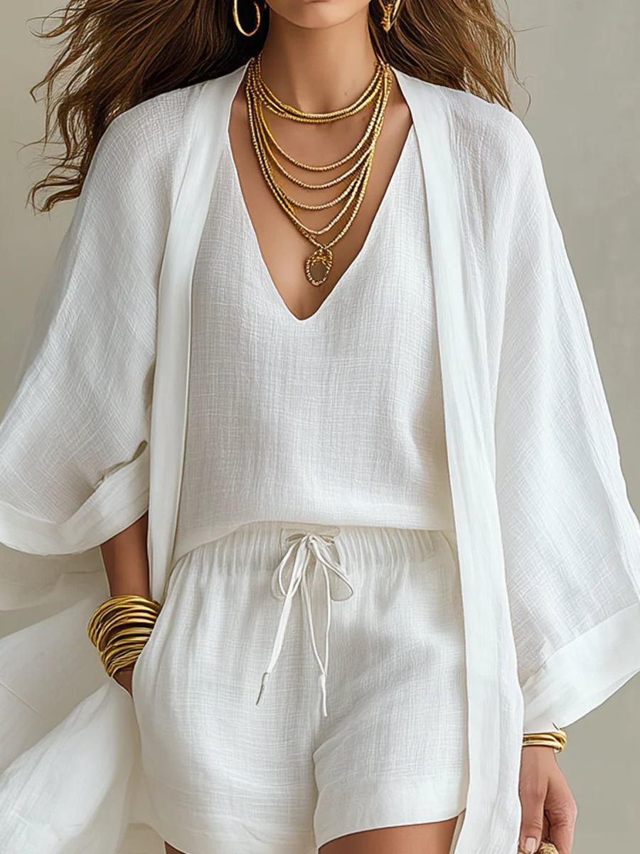 Sophie set in white, close-up of deep V-neck top and cardigan