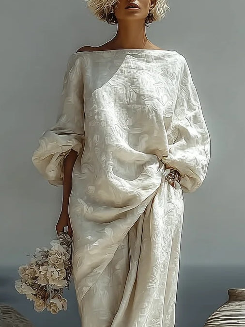 Close view of Isabella off-the-shoulder textured top in off white