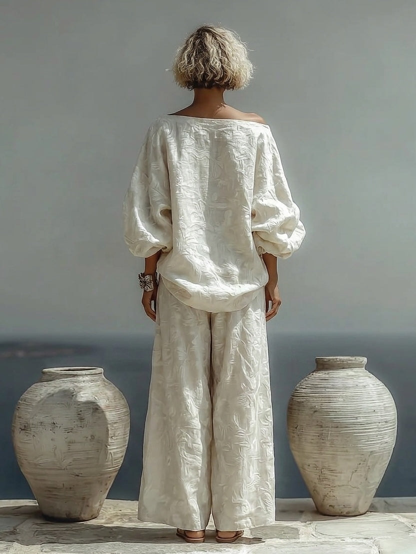 Isabella textured two-piece set in off white, back view showing lantern sleeves
