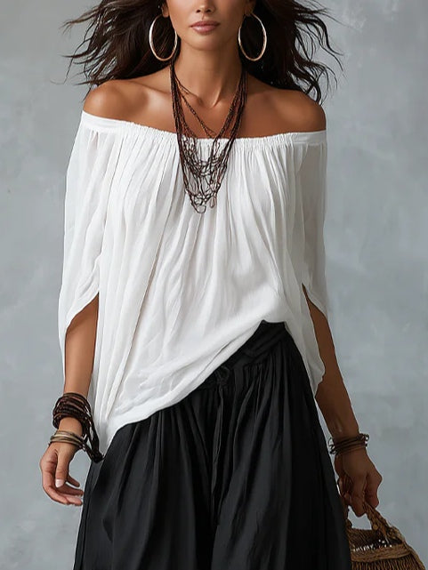 Raffaella off-shoulder top in white, close-up of draped neckline