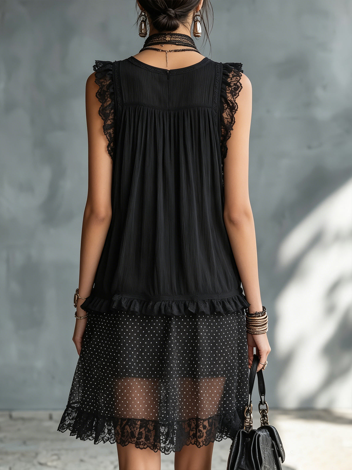 Pauline polka-dot mini dress in black, back view with ruffled waist