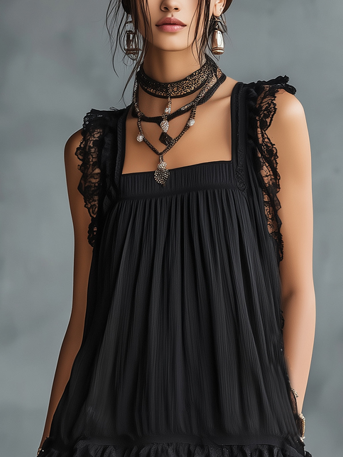 Close-up of Pauline dress square neckline and lace ruffle straps in black