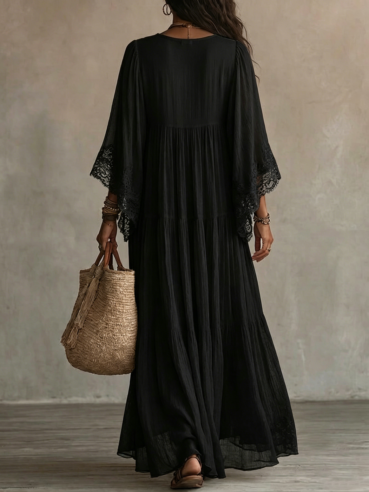 Ravenna black batwing maxi dress, back view with gathered skirt