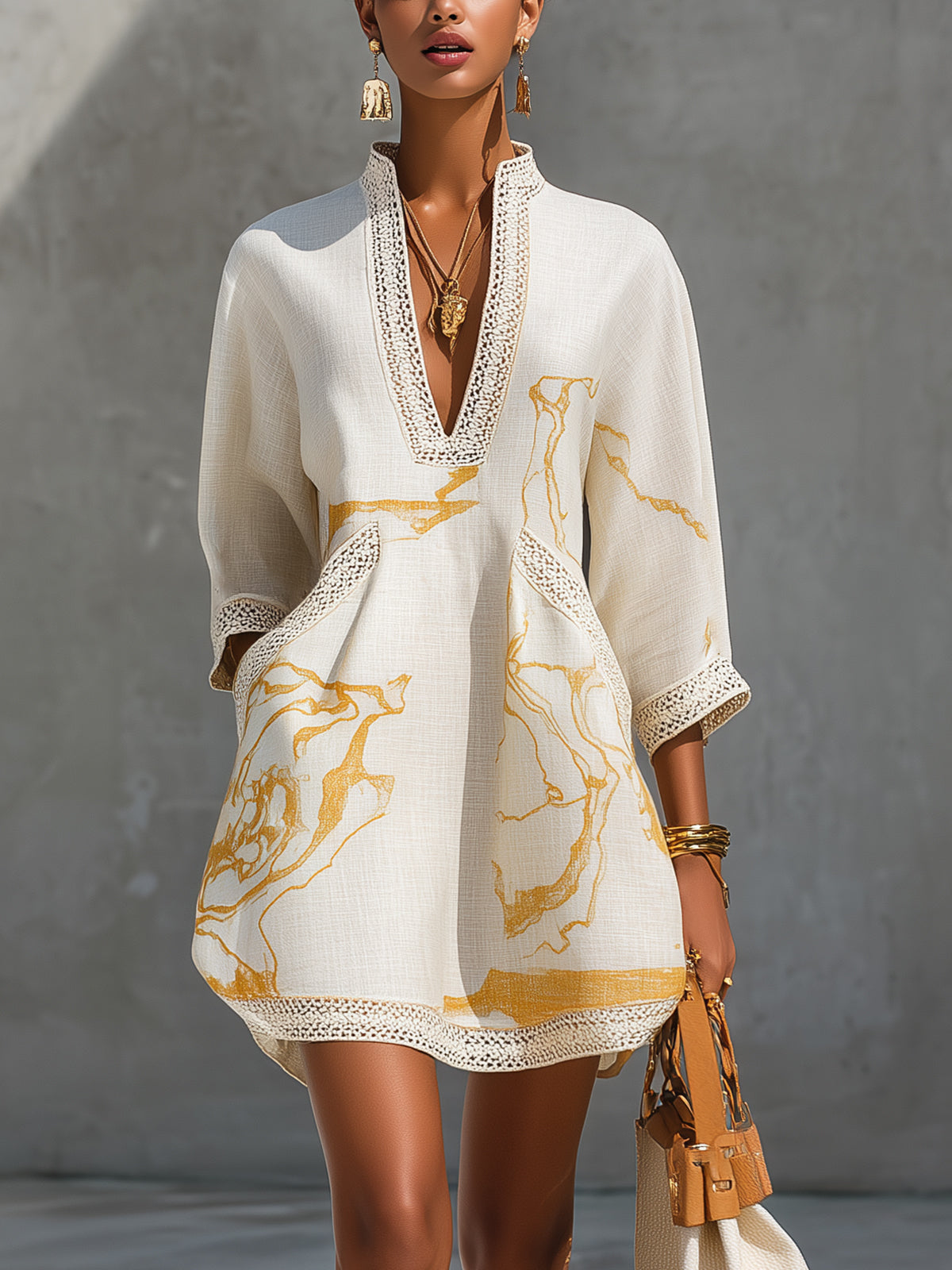 Aliénor crochet lace mini dress in ivory with gold print, front view