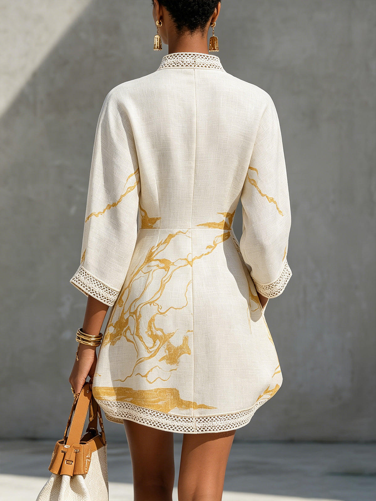 Aliénor ivory mini dress, back view with gold marbled print